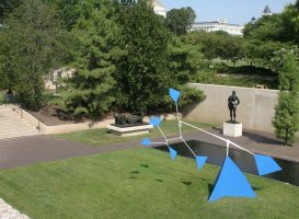 Blue triangular mobile in sculpture garden