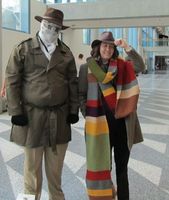 Rorschach on left, Dr. Who (Tom Baker version with long scarf) on right.