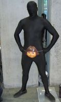 Man in black bodysuit with a mask over his crotch.