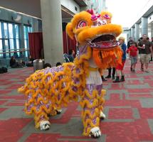 Chinese lion dancers in yellow costume