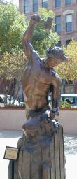 Statue of man sculpting himself