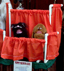 [puppet show in a box]