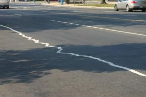 Highway divider stripe painted in an erratic squiggle
