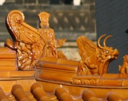 extreme closeup of wooden dragons on gate