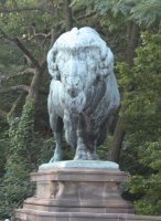Statue of buffalo on bridge