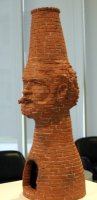 Man smoking cigar, with chimney for head
