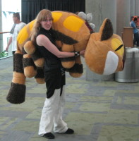 Girl with very large Totoro plush animal