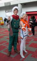 Video game characters; chef with giant fork on left, women in sailor costume on right.