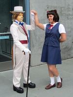 Anthropomorphic animals; one in white 1890s type suite, other in schoolgirl uniform.