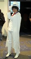 Woman dressed as “Kaitou Kid” from Detective Conan anime series.