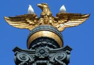 Eagle lamppost with pigeons