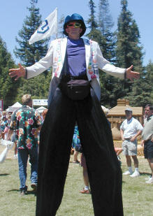 Stilt walker with multicolored
    sunglasses